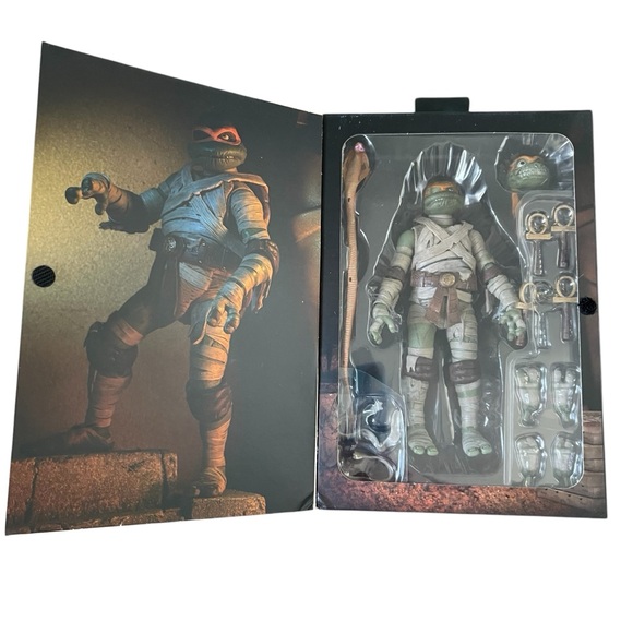 NECA TMNT X UNIVERSAL MONSTERS MICHELANGELO AS THE MUMMY UTLIMATE ACTION FIGURE - Picture 1 of 7